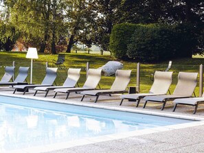 Seasonal outdoor pool, open 9:00 AM to 9:00 PM, sun loungers