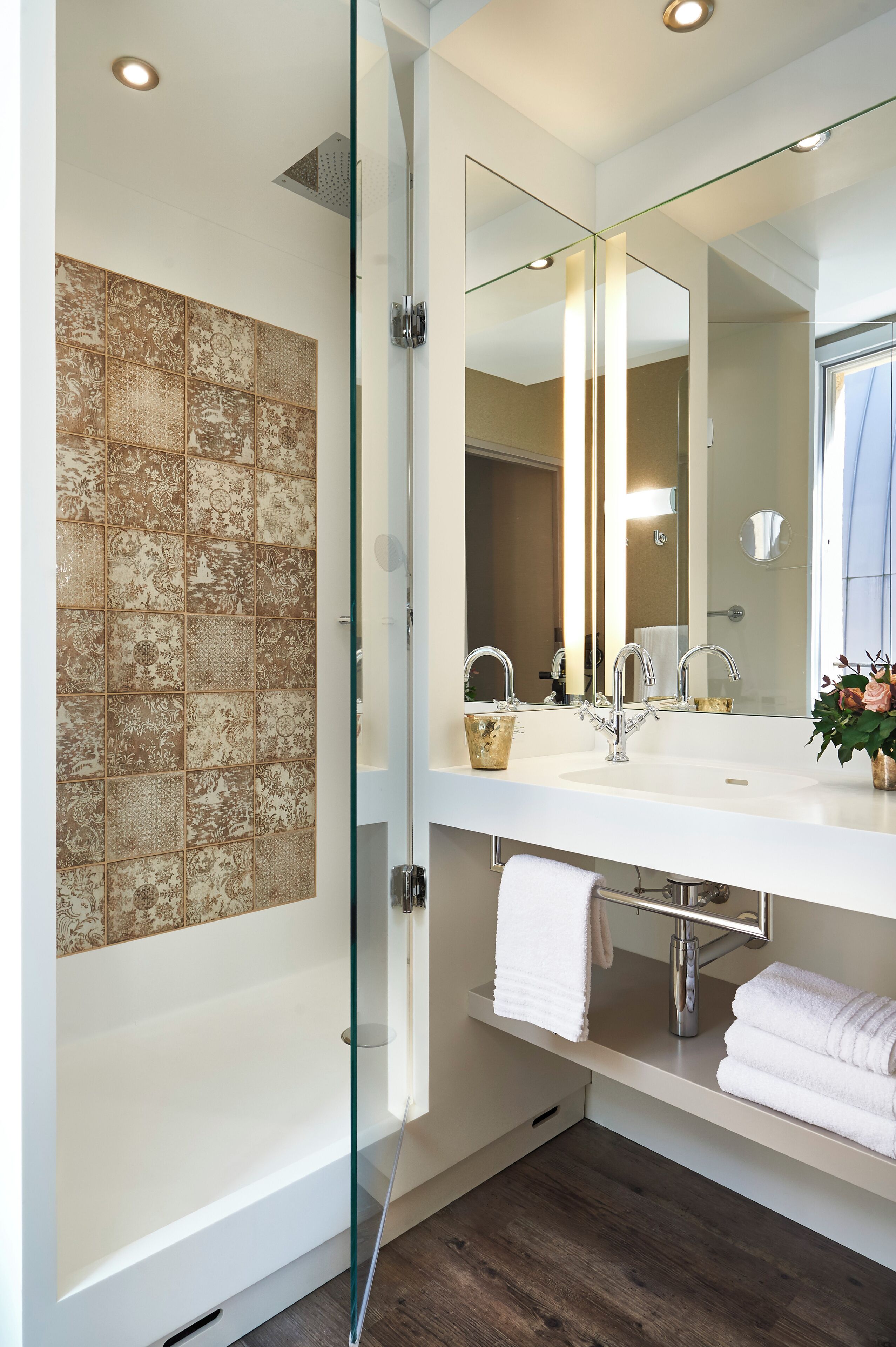 rainfall showerhead, designer toiletries, hair dryer, towels