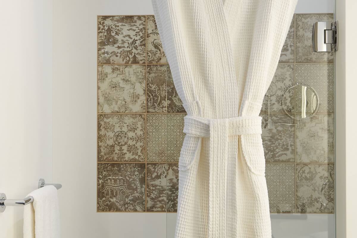 rainfall showerhead, designer toiletries, hair dryer, towels