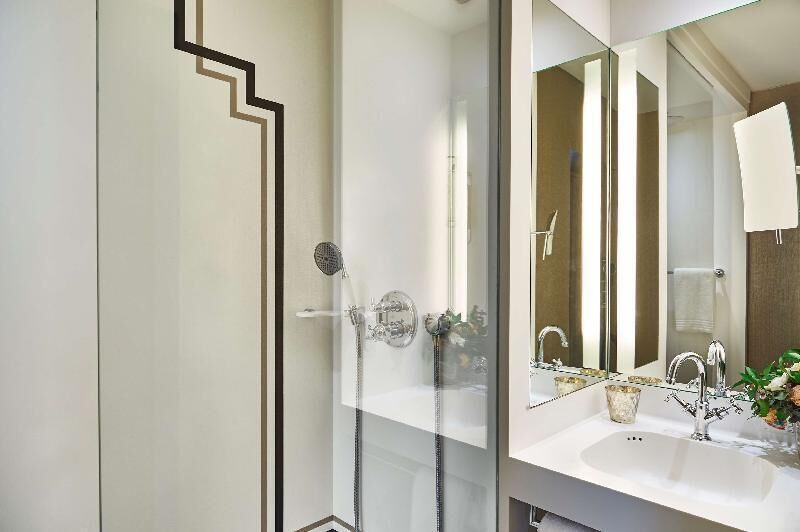 Bathroom | Rainfall showerhead, designer toiletries, hair dryer, towels