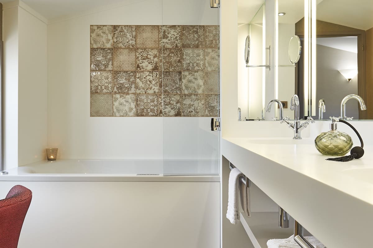 family suite | bathroom | rainfall showerhead, designer toiletries, hair dryer, towels