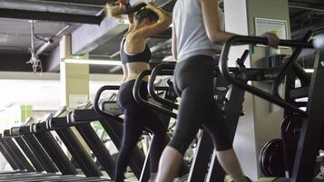A gym with treadmills and exercise equipment.