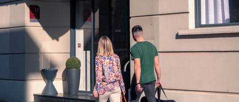 A hotel entrance with a sign reading "HOTEL".