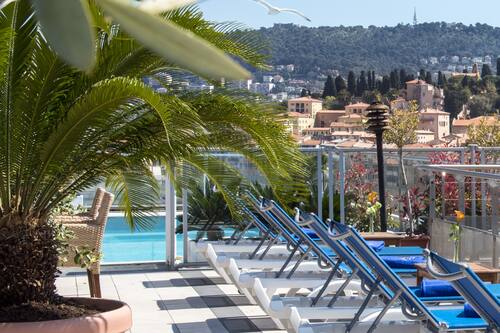 Seasonal outdoor pool, open 10:00 AM to 5:00 PM, pool umbrellas