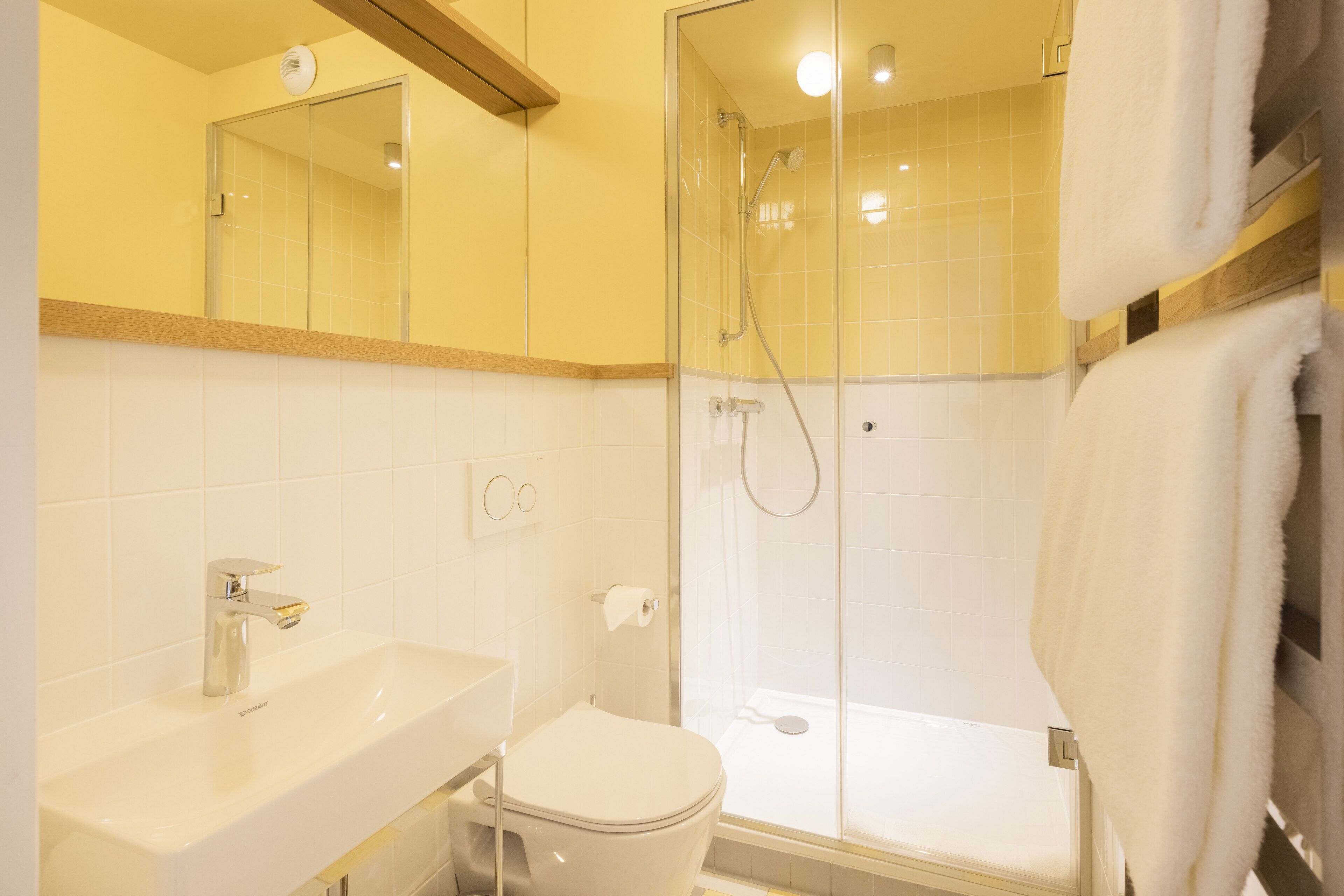 shower, designer toiletries, hair dryer, towels