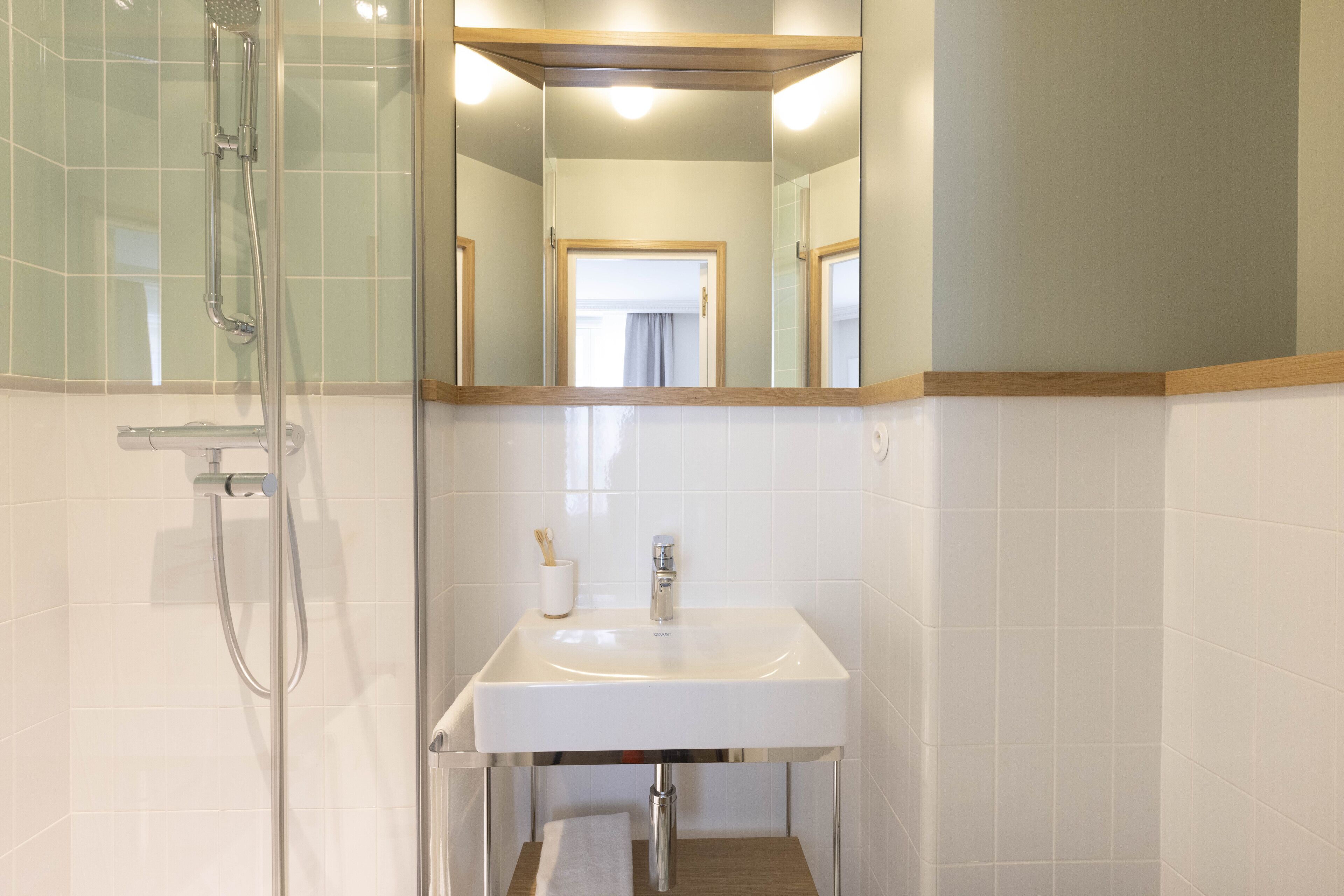 shower, designer toiletries, hair dryer, towels