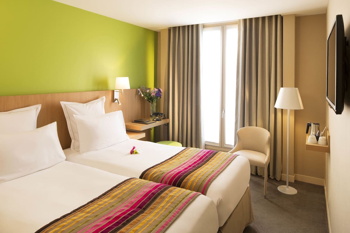Hypo-allergenic bedding available, down comforters, in-room safe, desk