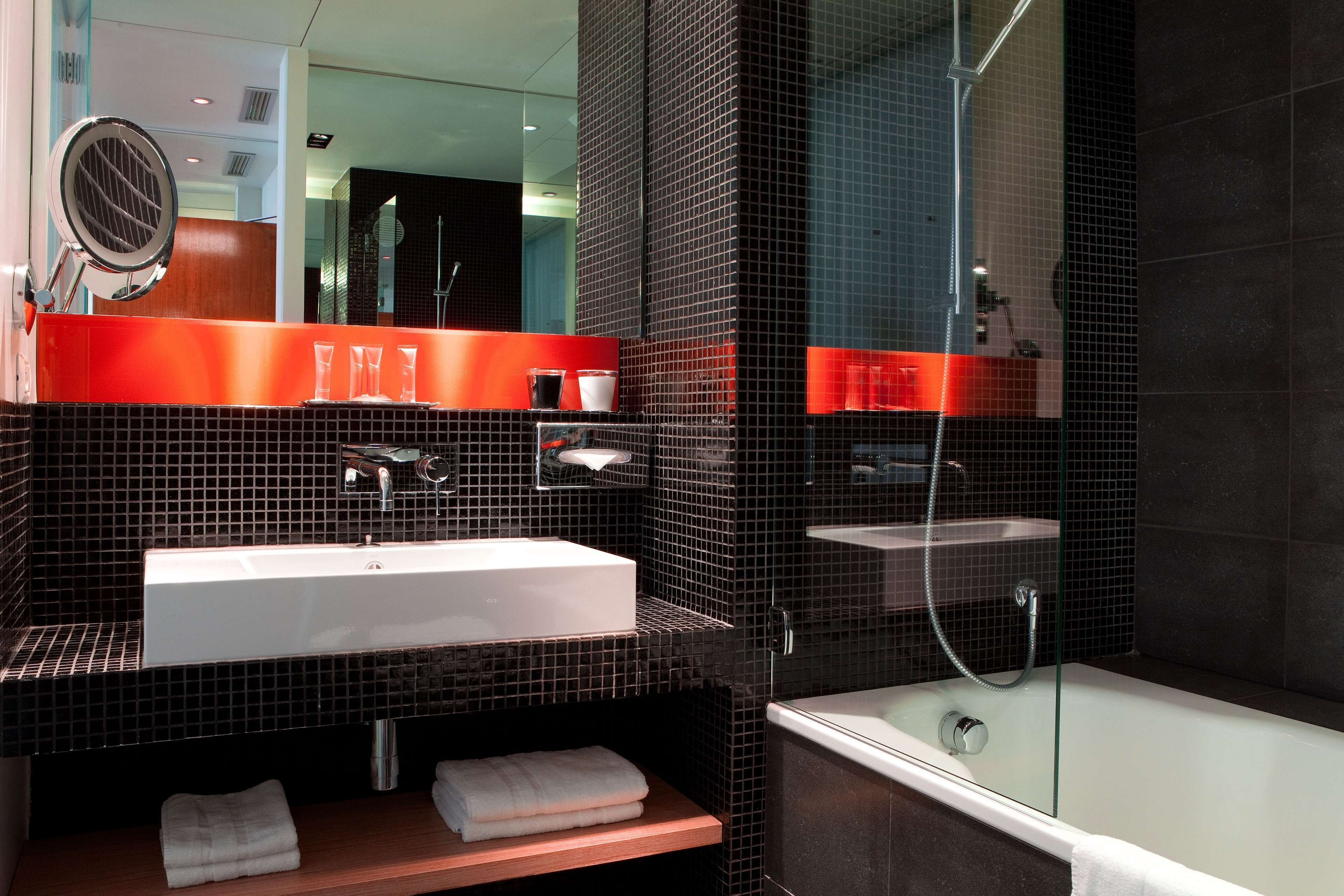 deep-soaking bathtub, rainfall showerhead, designer toiletries