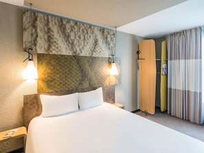 Hypo-allergenic bedding, desk, laptop workspace, blackout drapes