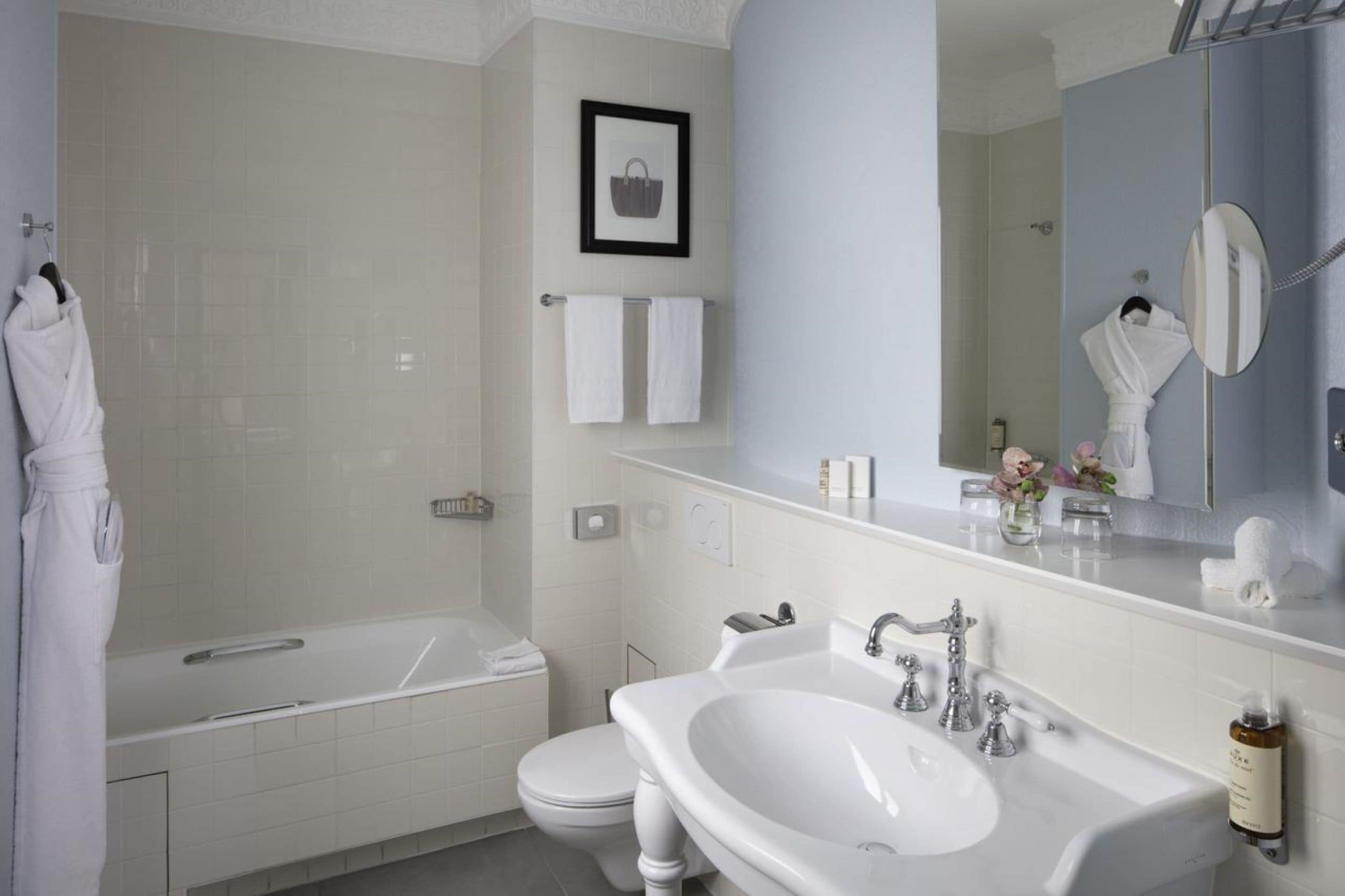 standard twin room - complimentary soft minibar, courtesy tray, chromecast - snacks, digital press | bathroom | free toiletries, hair dryer, bathrobes, slippers