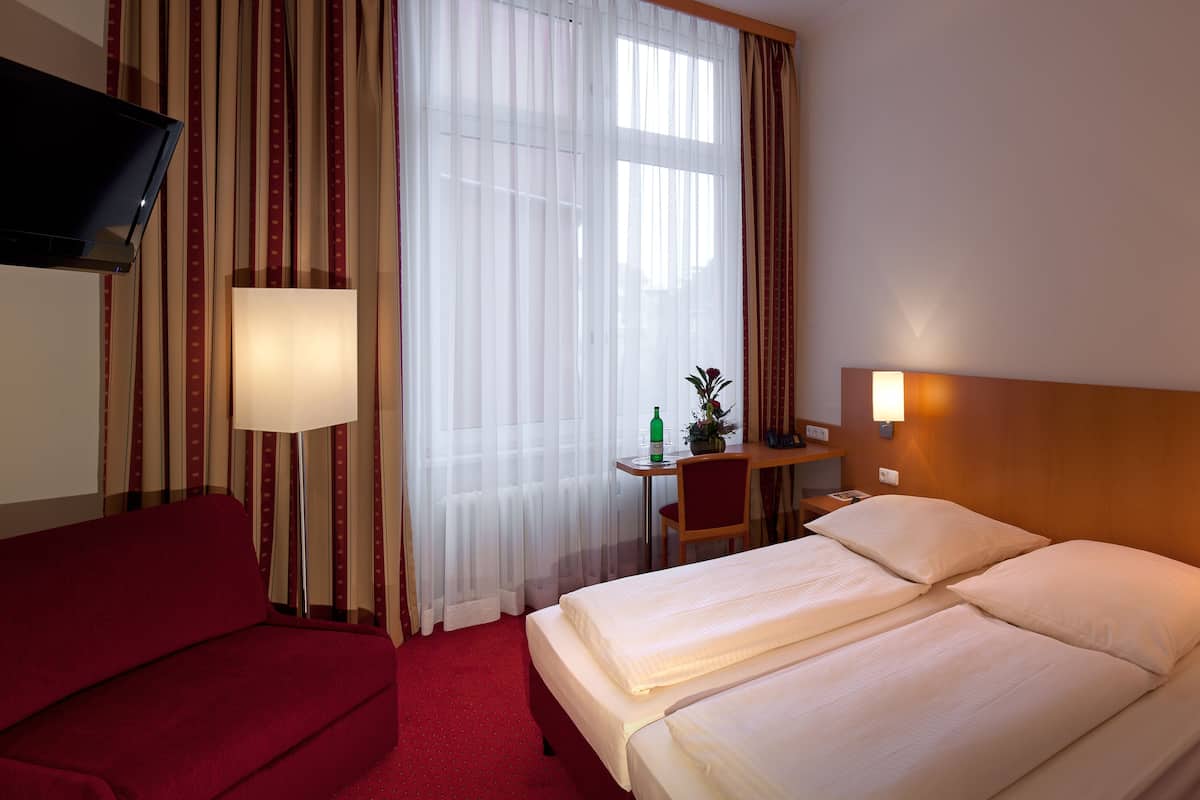 Hypo-allergenic bedding, minibar, in-room safe, individually furnished