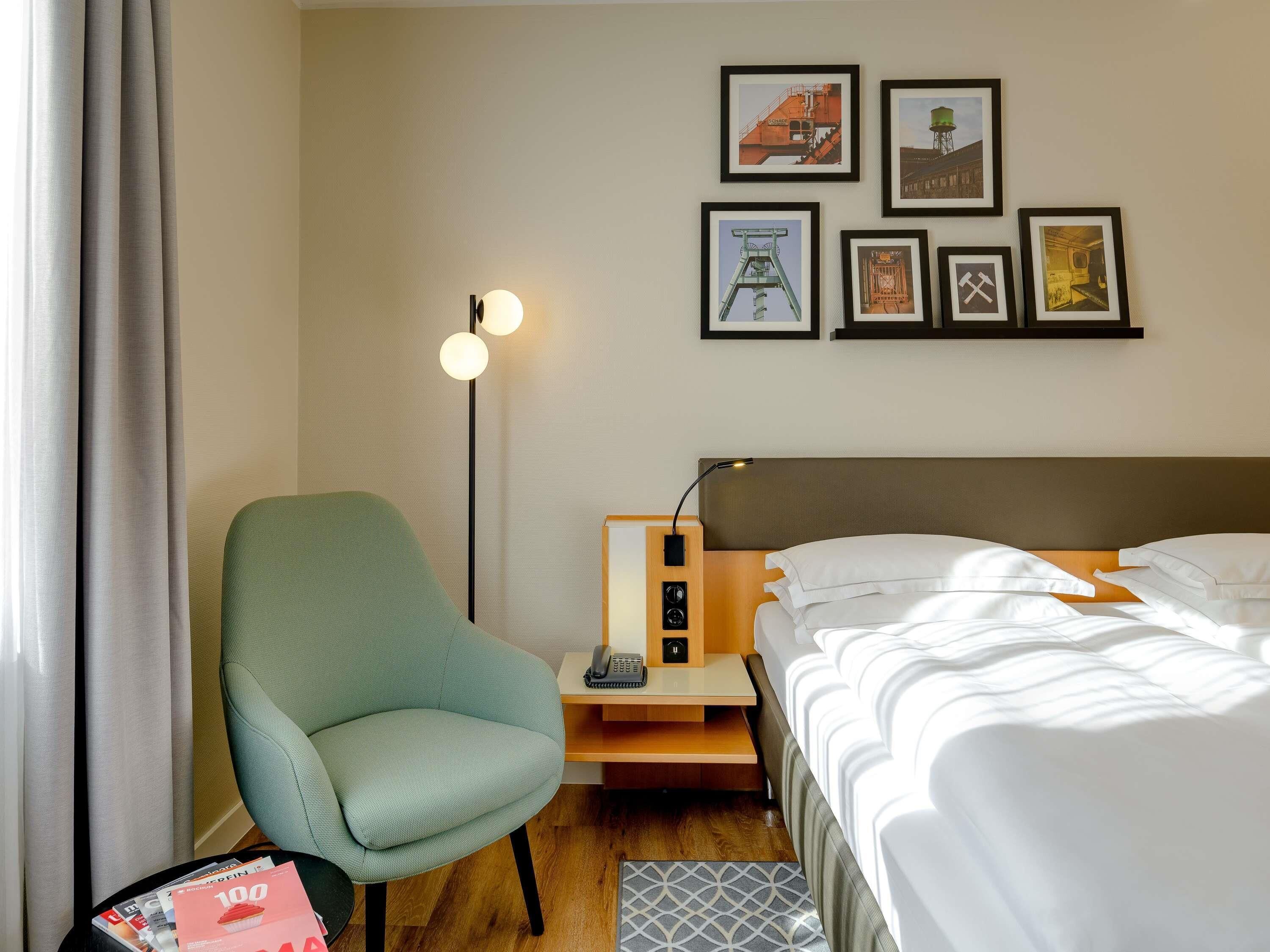 Premium bedding, desk, laptop workspace, blackout curtains