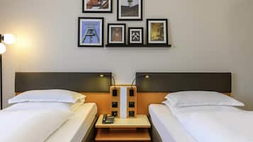 Premium bedding, desk, laptop workspace, blackout curtains