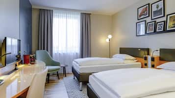 Premium bedding, desk, laptop workspace, blackout curtains
