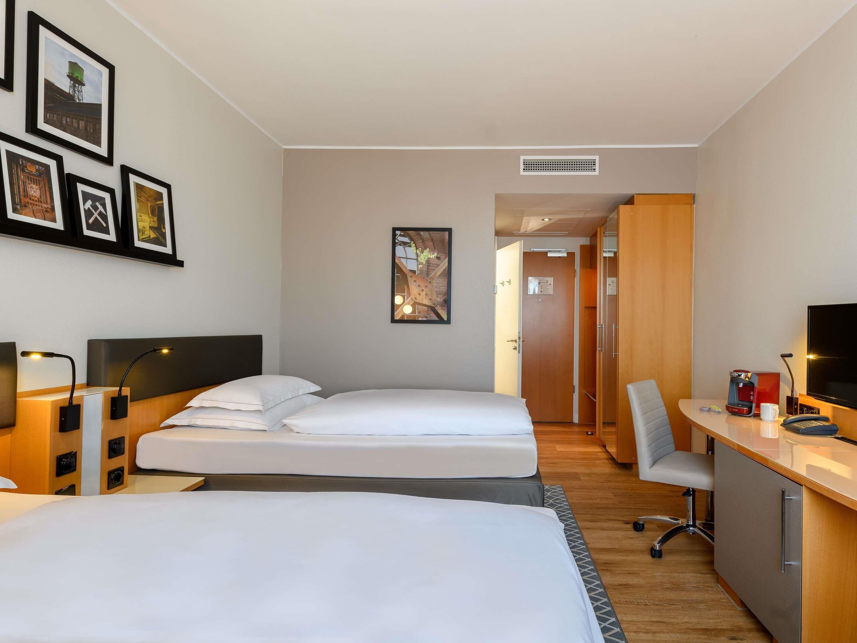 Premium bedding, desk, laptop workspace, blackout curtains