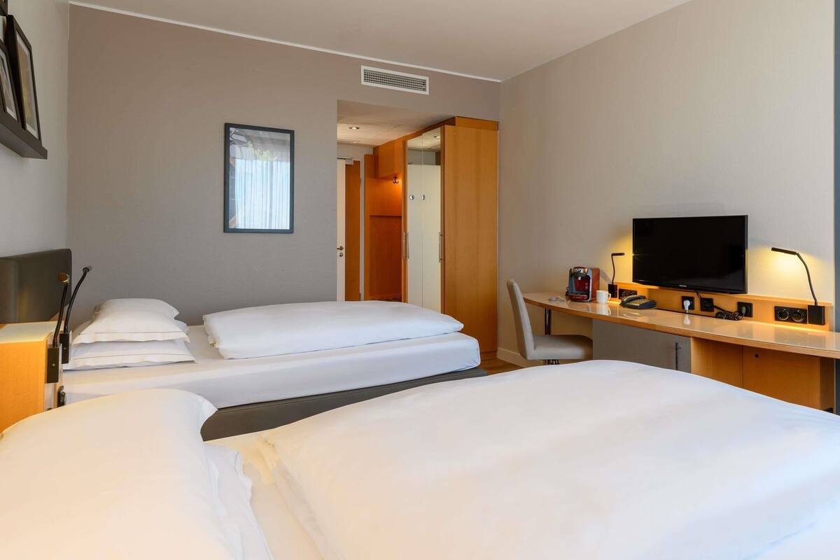 privilege, twin room, 2 single beds | premium bedding, desk, laptop workspace, blackout curtains
