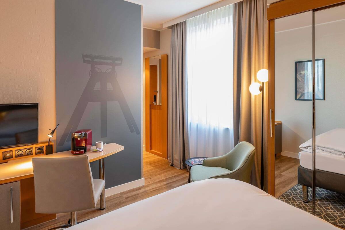 premium bedding, desk, laptop workspace, blackout curtains