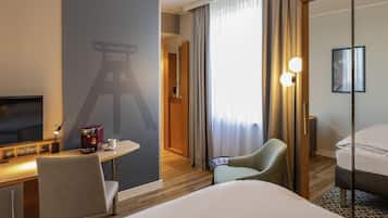 Premium bedding, desk, laptop workspace, blackout drapes