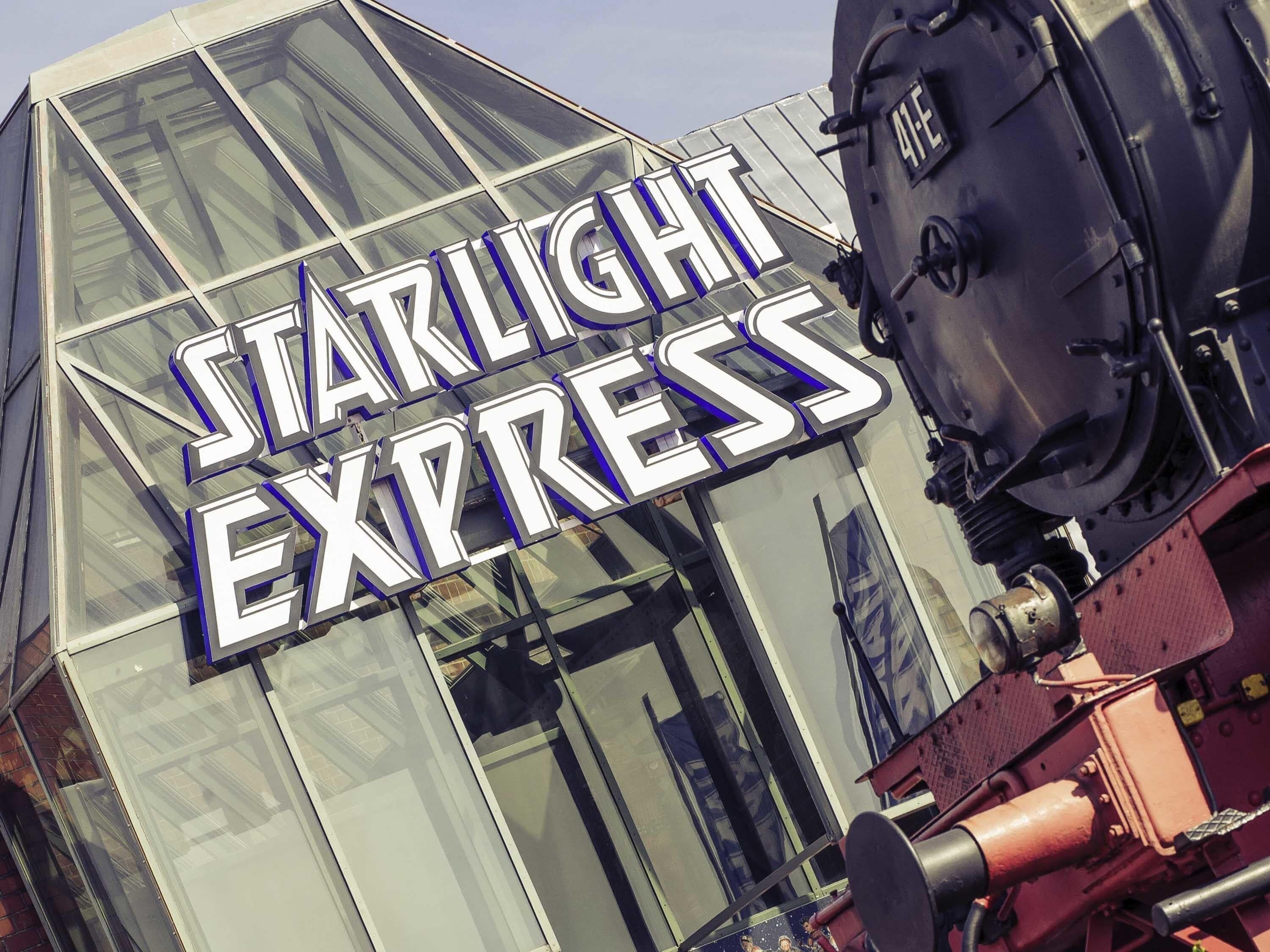 A building with a large sign reading 'Starlight Express'.