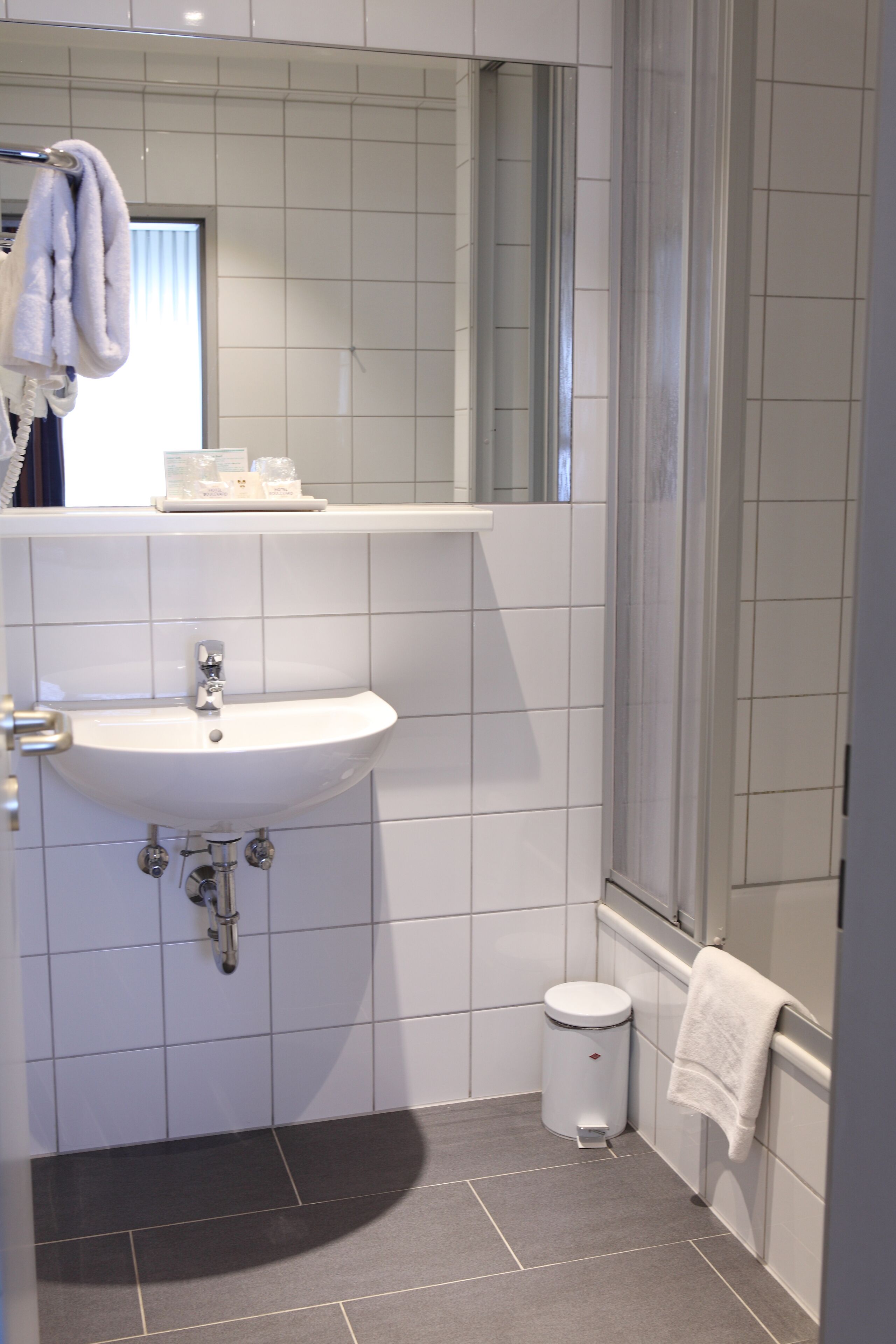 shower, free toiletries, hair dryer, towels