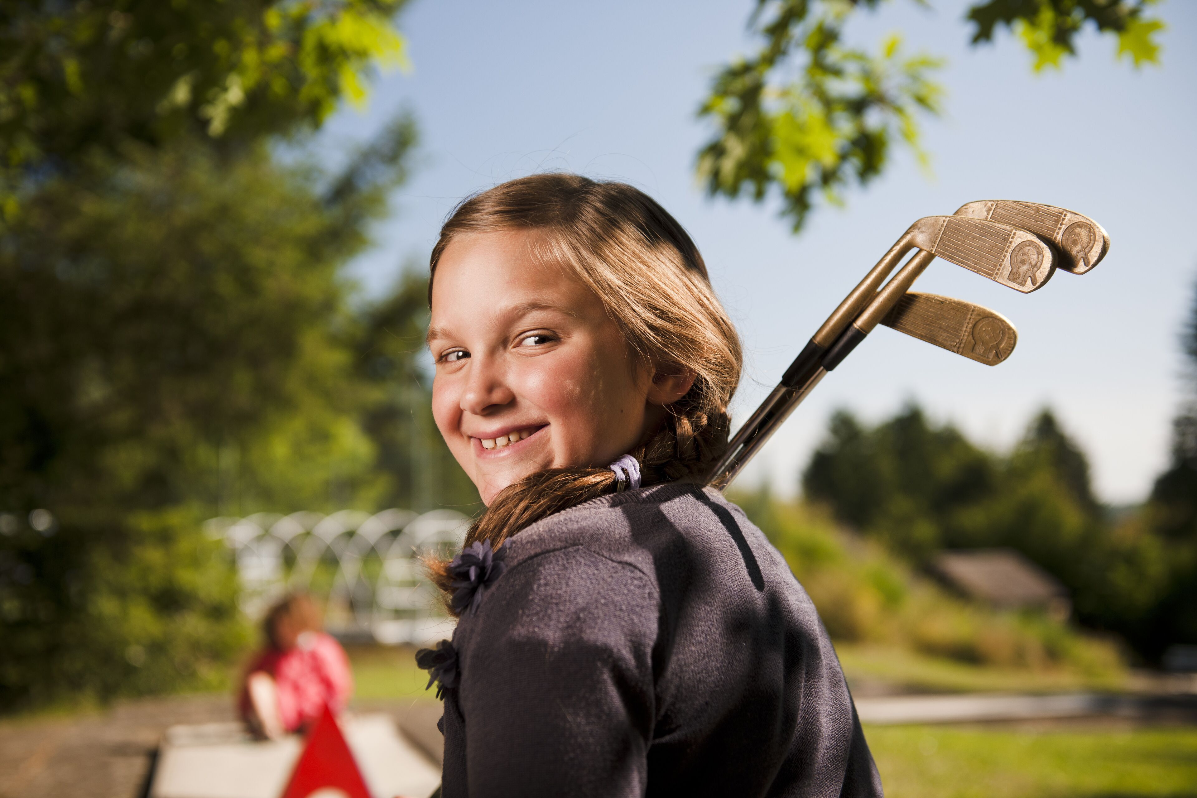 A person with a hockey stick.