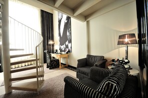 Maisonette Suite | Living area | Flat-screen TV