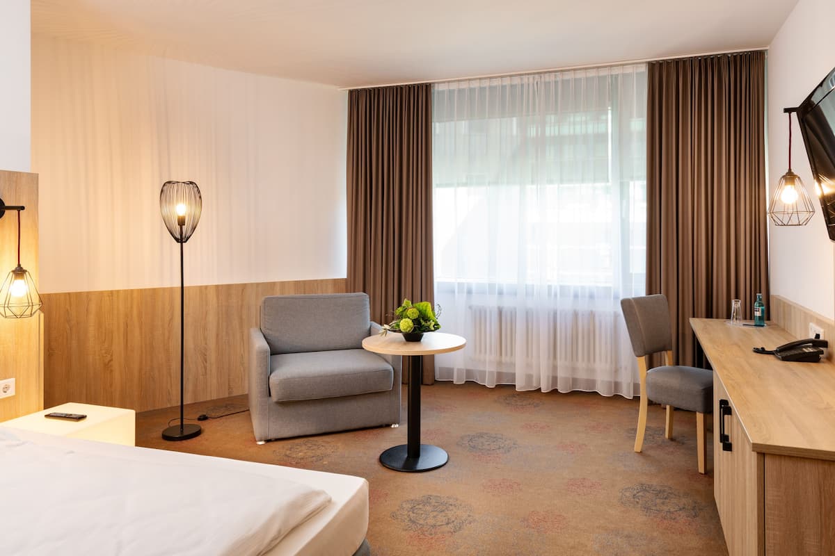 Hypo-allergenic bedding, desk, laptop workspace, blackout curtains