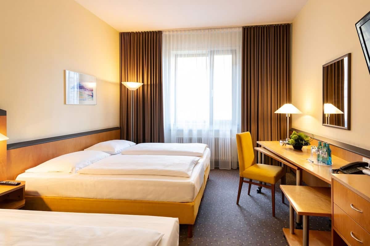 Hypo-allergenic bedding, desk, laptop workspace, blackout curtains