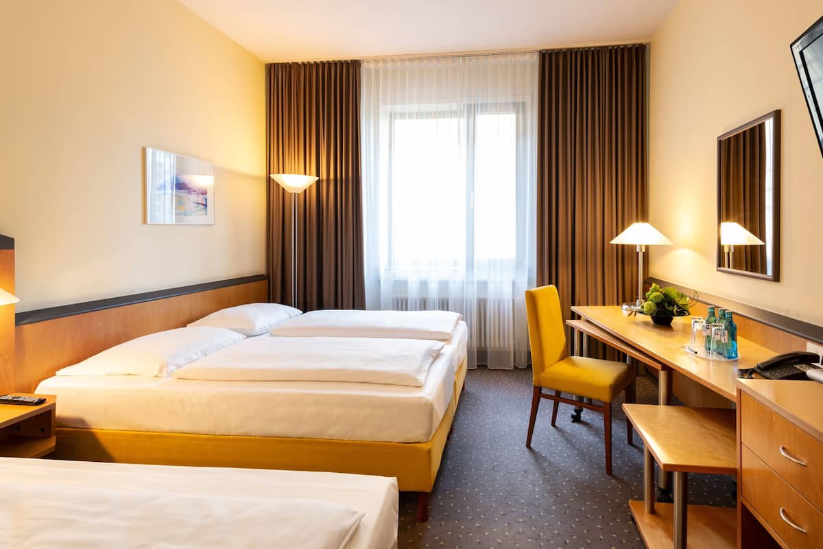 Hypo-allergenic bedding, desk, laptop workspace, blackout curtains