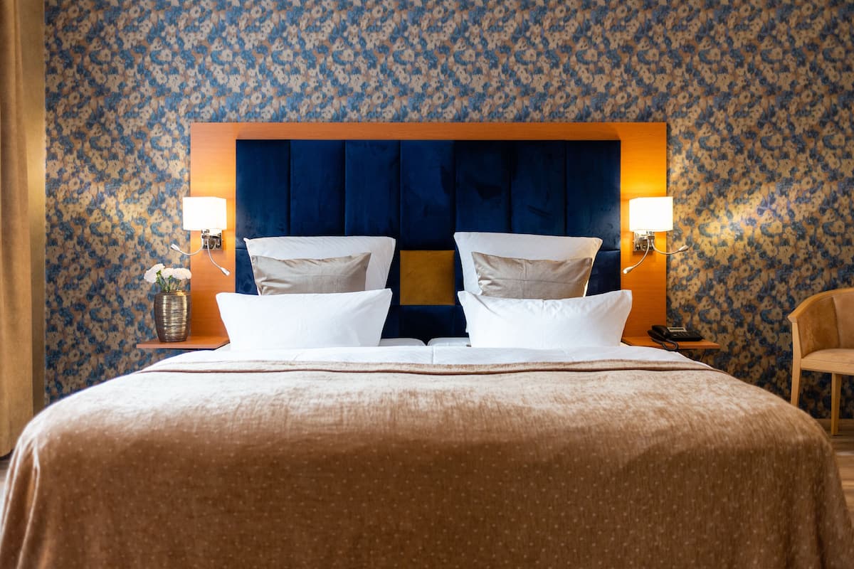 suite, 1 king bed, 2 bathrooms, garden area (incl. 3.50€ per room/night energy fee) | 1 bedroom, hypo-allergenic bedding, down duvets, in-room safe