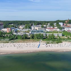 On the beach, white sand, sun-loungers, beach towels
