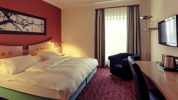 Hypoallergeen beddengoed, een minibar, een kluis op de kamer, een bureau