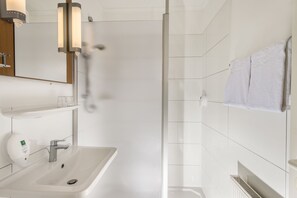 Shower, eco-friendly toiletries, hair dryer, towels