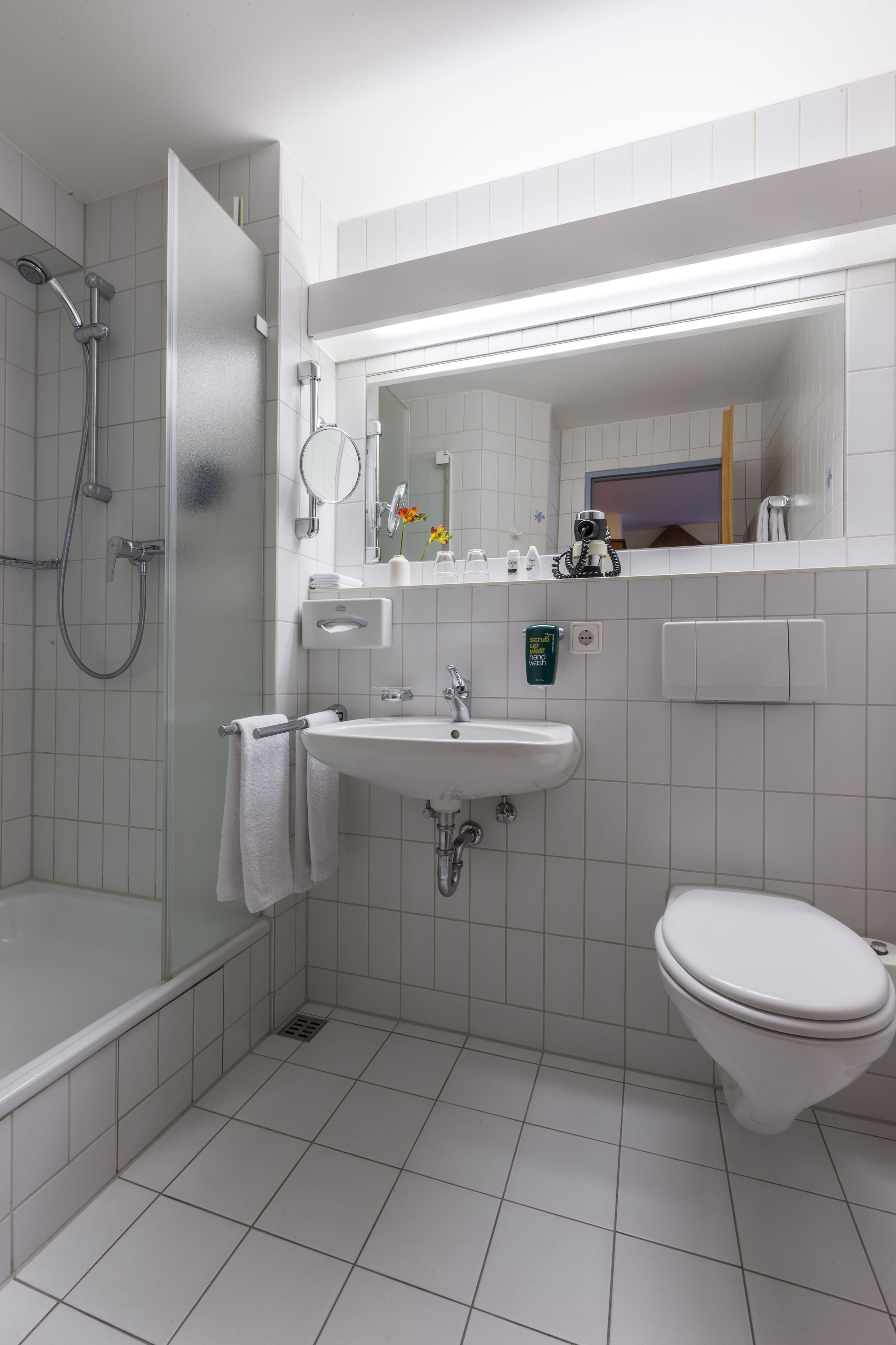 Shower, hair dryer, towels