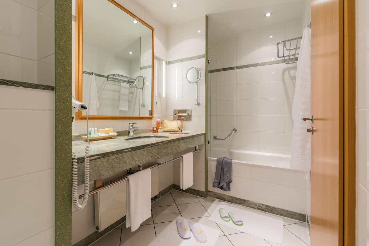 standard double room | bathroom | hair dryer, bathrobes, slippers, towels