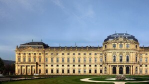 A large, historic building with a symmetrical facade, multiple windows, and a central dome. - Best Western Hotel Wuerzburg Sued (Würzburg)