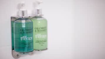 Two bottles of Gilchrist & Soames spa therapy body wash.