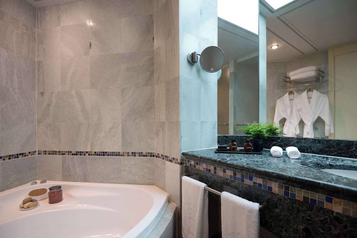 combined shower/bathtub, deep-soaking bathtub, designer toiletries