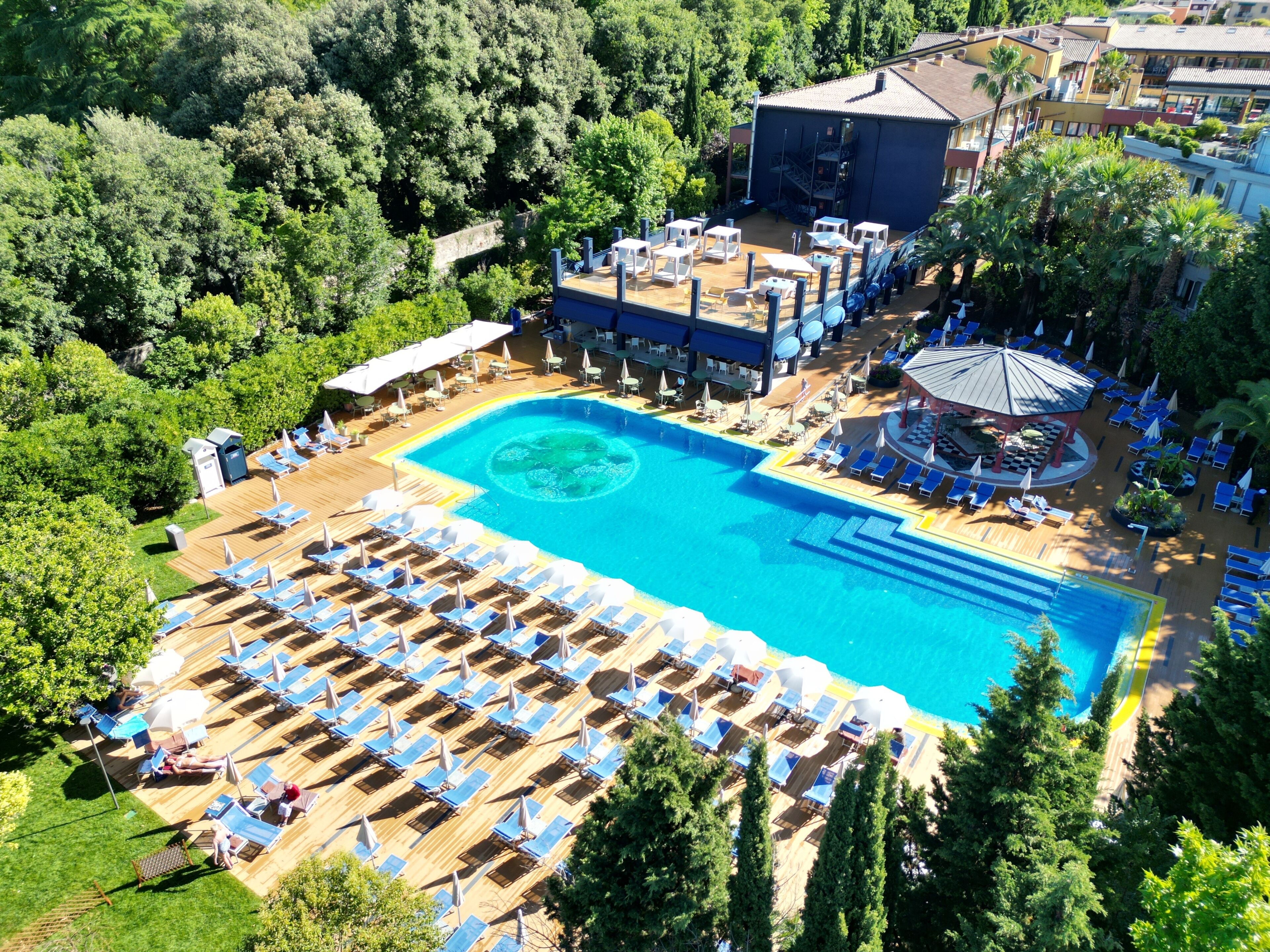 Indoor pool, seasonal outdoor pool, pool umbrellas, pool loungers