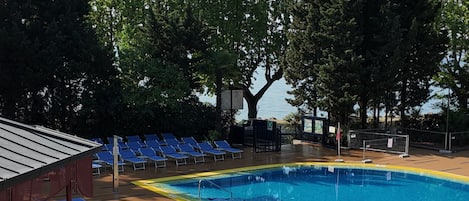 Indoor pool, seasonal outdoor pool, pool umbrellas, sun loungers