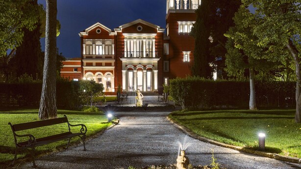 A large, historic building with a formal entrance, a central fountain, and a well-maintained garden. - Mercure Villa Romanazzi Carducci Bari (Bari)