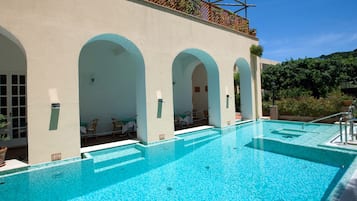 Seasonal outdoor pool, open 10:30 AM to 7:00 PM, pool umbrellas