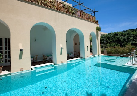 Seasonal outdoor pool, open 10:30 AM to 7:00 PM, pool umbrellas. Hotel Villa Sarah
