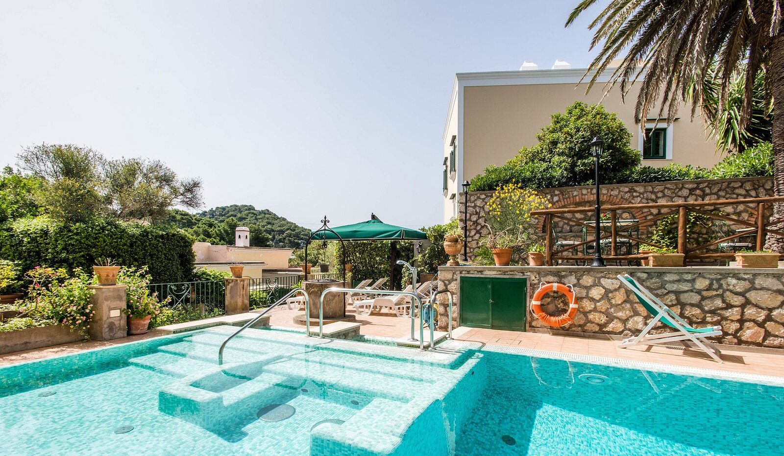 seasonal outdoor pool, open 10:30 am to 7:00 pm, pool umbrellas