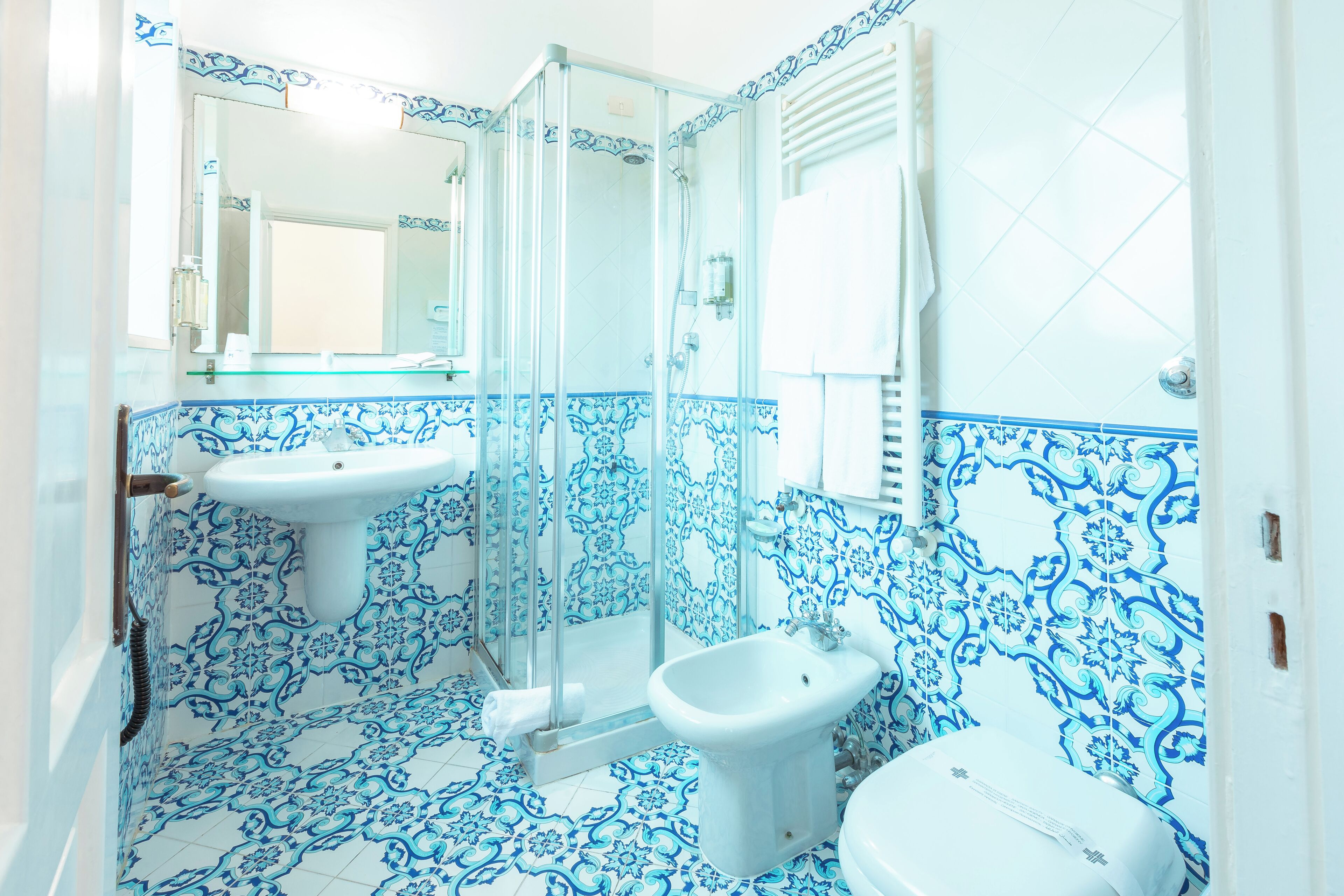 standard double room, garden view | bathroom | designer toiletries, hair dryer, slippers, bidet