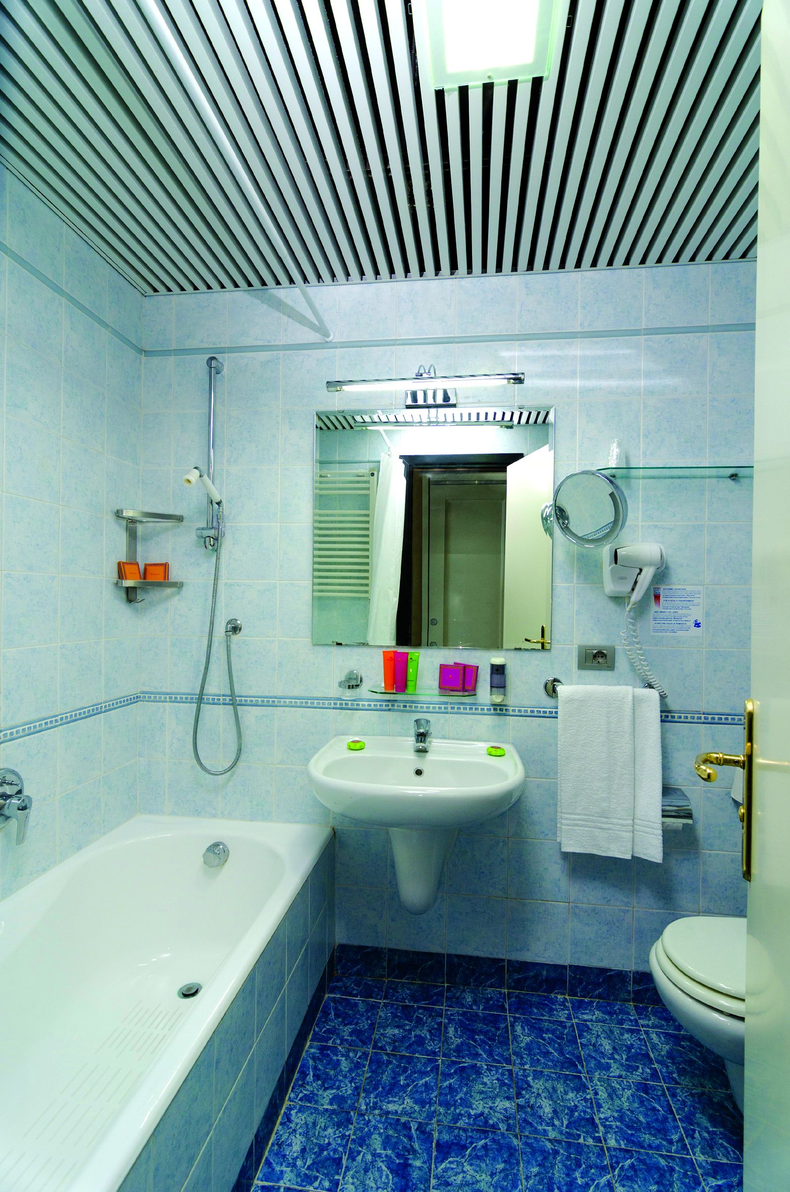 A bathroom with a bathtub, sink, and toilet.