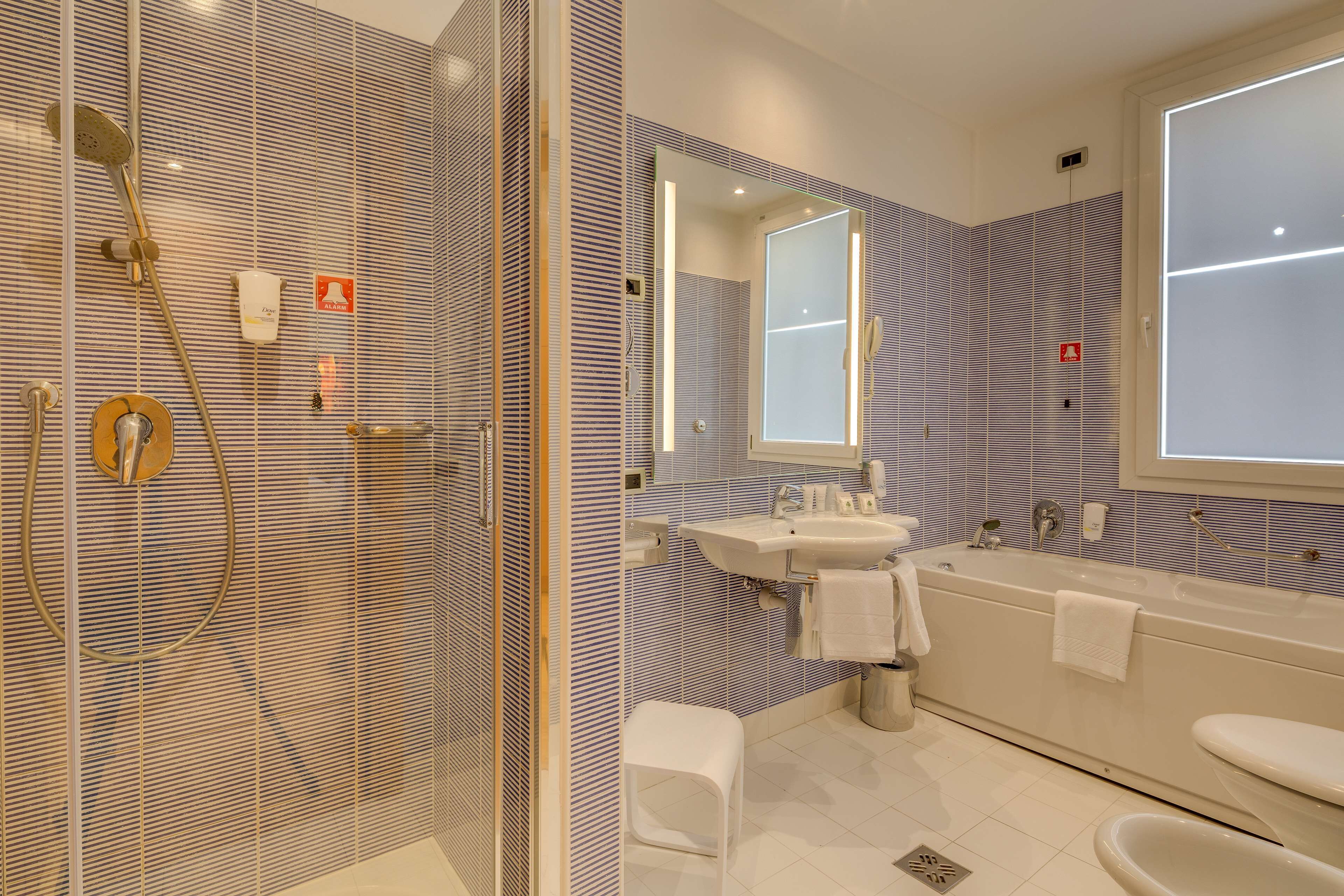 junior suite, 1 king bed | bathroom | free toiletries, hair dryer, slippers, bidet