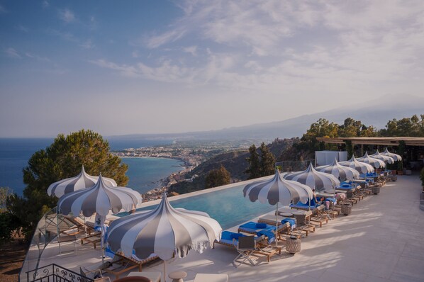 Relax by the sea with a view of distant landscapes from our outdoor lounge area.