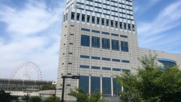 A tall, modern skyscraper with a grid-like facade and large windows. - Star Gate Hotel Kansai Airport (Izumisano)