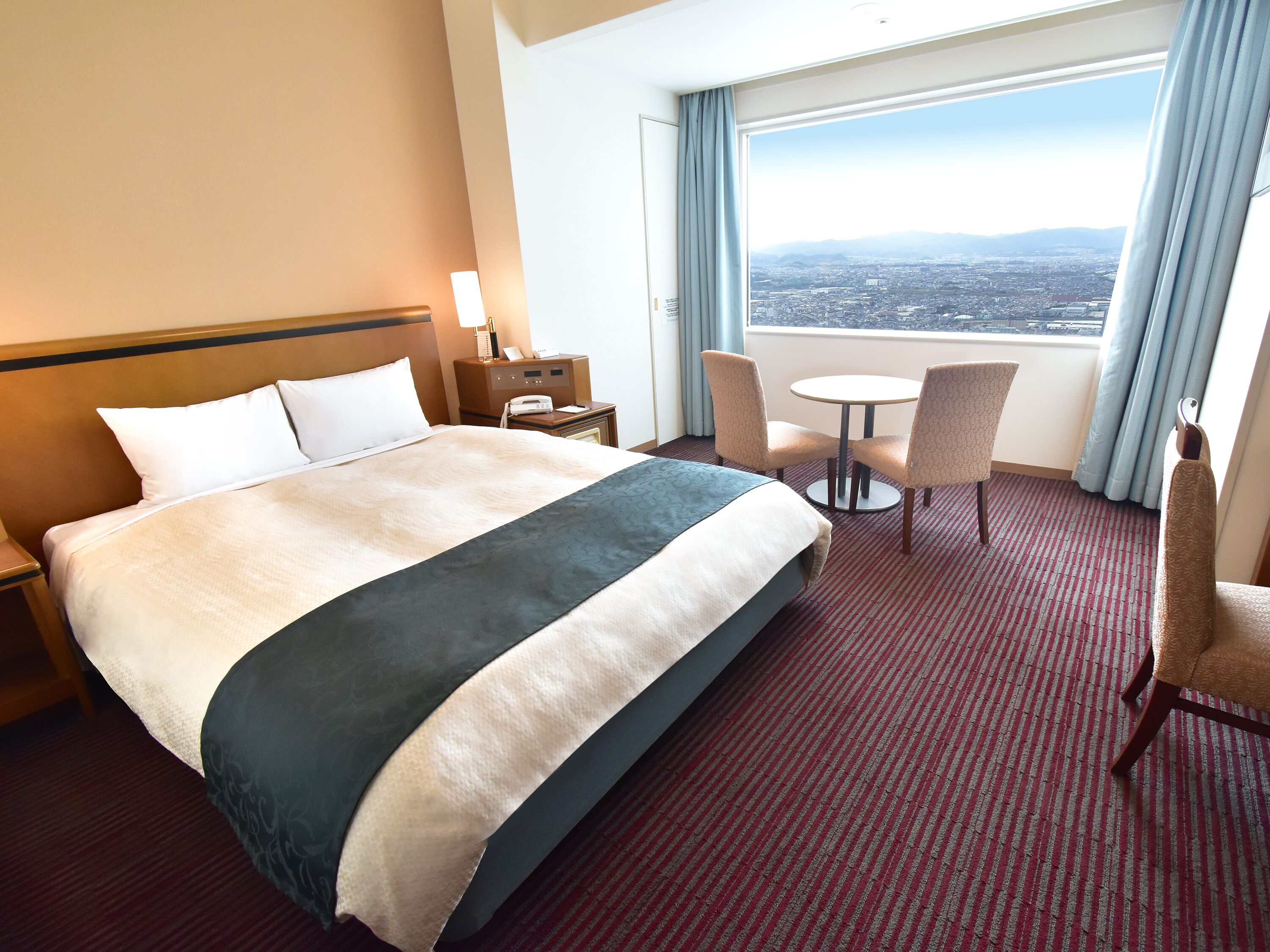 Double Room, Non Smoking (Airport Corner Double) | Down comforters, in-room safe, blackout drapes, iron/ironing board